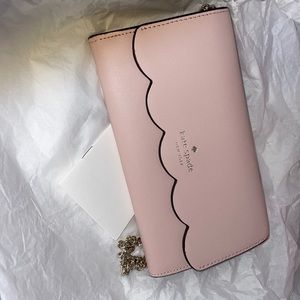 New and has a matching card holder